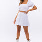 LE LIS Smocked Waist Flare Skirt