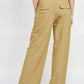ASYMMETRICAL LONG BELT TROUSERS
