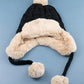 AILI'S CORNER Cable Weave Pom Trapper Hat