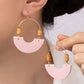 Leather and metal arch earrings with wood beads