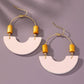 Leather and metal arch earrings with wood beads