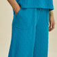 DOUBLE TAKE Full Size Texture Drawstring Short Sleeve Hoodie and Pocketed Pants Set