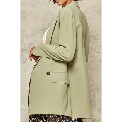 Une veste blazer tissée solide